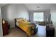 Spacious bedroom with neutral color palette and large window for natural light at 2436 Moultrie Ct, Dacula, GA 30019