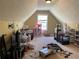 Spacious upper bedroom featuring natural light and unique ceiling at 2436 Moultrie Ct, Dacula, GA 30019