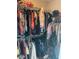 Walk-in closet filled with clothing and accessories, maximizing storage at 2436 Moultrie Ct, Dacula, GA 30019
