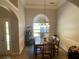 Dining room with ornate crown molding, a decorative arched window and hardwood flooring at 2436 Moultrie Ct, Dacula, GA 30019