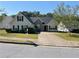 Charming single-Gathering home featuring a well-maintained front yard, a symmetrical design, and an inviting entrance at 2436 Moultrie Ct, Dacula, GA 30019