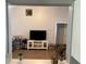 Spacious living room with neutral walls and flooring adjacent to the kitchen area at 2436 Moultrie Ct, Dacula, GA 30019