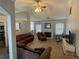 Bright living room featuring hardwood floors, neutral paint, a fireplace, and comfortable seating at 2436 Moultrie Ct, Dacula, GA 30019