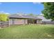 Backyard with a covered patio and green grass at 352 Southgate Dr, Locust Grove, GA 30248