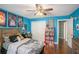 Bedroom with wood floors, ceiling fan, and themed decor at 352 Southgate Dr, Locust Grove, GA 30248