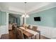 Traditional dining room featuring hardwood floors and modern wainscoting for a classic yet modern look at 352 Southgate Dr, Locust Grove, GA 30248