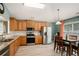 Light and airy kitchen featuring stainless steel appliances, light wood cabinets, and light floors at 352 Southgate Dr, Locust Grove, GA 30248