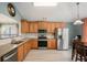 Bright kitchen with stainless steel appliances, light wood cabinets, and a subway tile backsplash at 352 Southgate Dr, Locust Grove, GA 30248