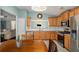 Open kitchen adjacent to living area with stainless steel appliances and room to entertain at 352 Southgate Dr, Locust Grove, GA 30248