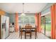 Open kitchen and dining area with stainless steel appliances and a sliding door to the yard at 352 Southgate Dr, Locust Grove, GA 30248
