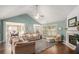 Bright living room featuring a high ceiling, hardwood floors, and fireplace at 352 Southgate Dr, Locust Grove, GA 30248