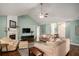 Bright living room featuring a high ceiling, hardwood floors, and fireplace at 352 Southgate Dr, Locust Grove, GA 30248