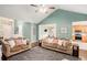 Bright living room featuring a high ceiling, hardwood floors, and an open layout at 352 Southgate Dr, Locust Grove, GA 30248