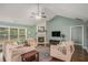 Bright living room featuring a high ceiling, hardwood floors, and fireplace at 352 Southgate Dr, Locust Grove, GA 30248