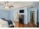 Main bedroom features wood floors, access to the ensuite bathroom and a hallway at 352 Southgate Dr, Locust Grove, GA 30248