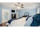 Main bedroom boasts a ceiling fan, wood floors, and light blue walls at 352 Southgate Dr, Locust Grove, GA 30248