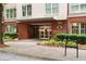 Welcoming entrance to Central City Condominiums with brick accents and manicured landscaping at 384 Ralph Mcgill Ne Blvd # 318, Atlanta, GA 30312