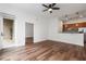 Open-concept living area with hardwood floors seamlessly transitions to a modern kitchen with stainless steel appliances at 384 Ralph Mcgill Ne Blvd # 318, Atlanta, GA 30312