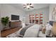 Spacious main bedroom with balcony, hardwood floors, ceiling fan, ensuite bathroom, and modern finishes at 384 Ralph Mcgill Ne Blvd # 318, Atlanta, GA 30312