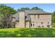 Expansive brick home exterior with well-maintained lawn, ideal for outdoor living and entertaining at 595 Mcgarity Dr, Mcdonough, GA 30252