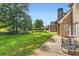 Lush backyard featuring a play structure and large grassy area, perfect for outdoor activities at 595 Mcgarity Dr, Mcdonough, GA 30252
