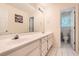 Bright bathroom featuring a dual sink vanity and a separate toilet area at 595 Mcgarity Dr, Mcdonough, GA 30252