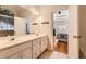 Bathroom featuring double sinks, white cabinetry, and tile flooring at 595 Mcgarity Dr, Mcdonough, GA 30252