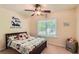 Charming bedroom with a ceiling fan and a window providing natural light at 595 Mcgarity Dr, Mcdonough, GA 30252