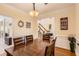 Dining room with hardwood floors, decorative signs, and a table for entertaining at 595 Mcgarity Dr, Mcdonough, GA 30252
