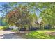 Brick house with an attached garage and mature trees in the front yard at 595 Mcgarity Dr, Mcdonough, GA 30252