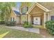 Inviting entrance with brick accents, 'WELCOME' sign, and decorative door creating a warm first impression at 595 Mcgarity Dr, Mcdonough, GA 30252