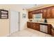 Kitchen with wooden cabinets, stainless steel appliances and tile flooring at 595 Mcgarity Dr, Mcdonough, GA 30252