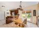 Eat-in kitchen features wood cabinets, tile floors, and access to the backyard at 595 Mcgarity Dr, Mcdonough, GA 30252