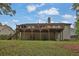 Wide backyard featuring a deck, ample green space, and partial fencing at 2582 Oak Bluff Dr, Dacula, GA 30019