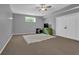 Simple bedroom offers carpeted flooring, a ceiling fan, a window, and access to a storage closet at 2582 Oak Bluff Dr, Dacula, GA 30019
