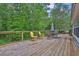 Spacious deck showcases a dining table, chairs, and backyard views at 2582 Oak Bluff Dr, Dacula, GA 30019