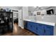 Charming kitchen featuring blue cabinets, stainless steel appliances, and a modern design at 2582 Oak Bluff Dr, Dacula, GA 30019