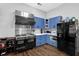 Spacious kitchen with stainless steel appliances and blue cabinets, perfect for cooking enthusiasts at 2582 Oak Bluff Dr, Dacula, GA 30019