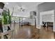 Spacious living area featuring hardwood floors, ceiling fans, and large windows for natural light at 2582 Oak Bluff Dr, Dacula, GA 30019
