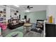 Living room with laminated floors and a brown leather sofa with cup holders at 2582 Oak Bluff Dr, Dacula, GA 30019