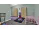 Unfinished room with laminated wood flooring and cabinets with storage at 2582 Oak Bluff Dr, Dacula, GA 30019