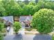 An aerial view of a two-story home with a well-manicured lawn and beautiful curb appeal at 5008 Bethpage Dr, Suwanee, GA 30024