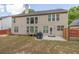 Backyard with patio, mature trees, and well-maintained lawn at 5008 Bethpage Dr, Suwanee, GA 30024