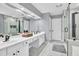 Elegant bathroom featuring double vanity, soaking tub, and glass enclosed shower at 5008 Bethpage Dr, Suwanee, GA 30024