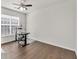 Bedroom with hardwood floors, ceiling fan, and sunny window at 5008 Bethpage Dr, Suwanee, GA 30024