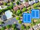 Aerial view of community amenities, including a pool, tennis courts, parking, and green spaces at 5008 Bethpage Dr, Suwanee, GA 30024