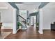 Grand foyer with elegant hardwood floors, staircase, and abundant natural light at 5008 Bethpage Dr, Suwanee, GA 30024
