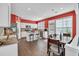 Kitchen features a center island with bar stools, stainless steel appliances, and hardwood floors for a modern design at 5008 Bethpage Dr, Suwanee, GA 30024