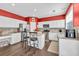 Well-equipped kitchen with white cabinetry, stainless steel appliances, hardwood floors, and island for casual dining at 5008 Bethpage Dr, Suwanee, GA 30024