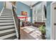Bright, open-concept living room with high ceilings, large windows, and hardwood floors at 5008 Bethpage Dr, Suwanee, GA 30024